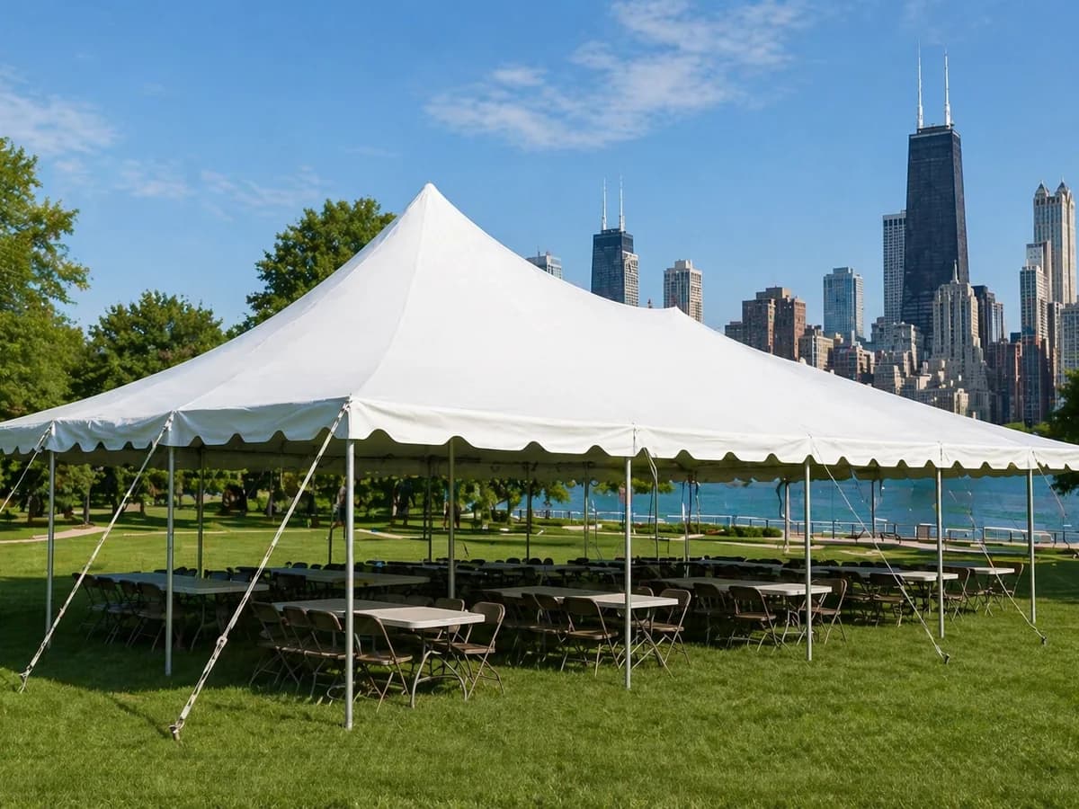Elegant outdoor event tent setup with Chicago city views in the background